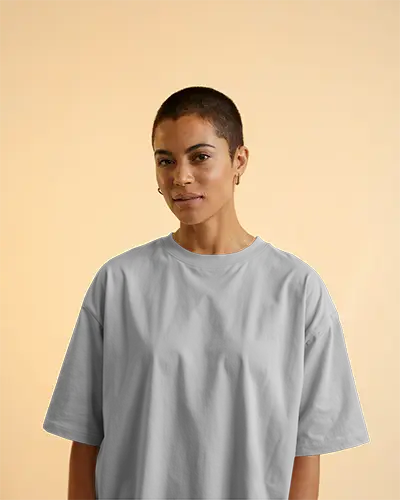 Minimalist Studio Tshirt Mockup Woman With Buzzcut Smiling In White Tee Soft Yellow Background Clean And Modern Portrait