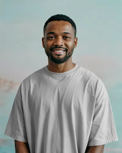 Pastel Sky Background Tshirt Mockup Male Model Smiling In White Tee Natural Light Minimal And Fresh Brand Look