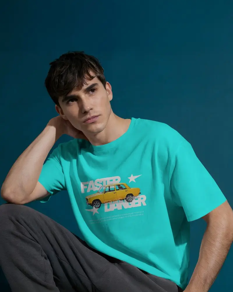 Introspective Pose Tshirt Mockup Man In White Tshirt And Dark Pants On Muted Blue Backdrop
