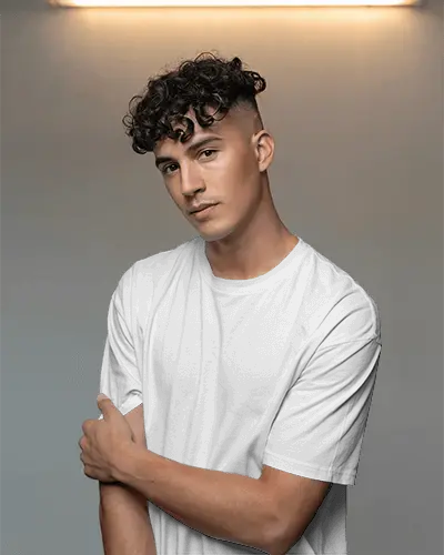 Modern Male T Shirt Mockup With Graphic Design Space On Model In Soft Lighting