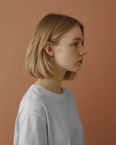 Modern Profile Tshirt Mockup Girl Facing Right Against Solid Clay Wall Color