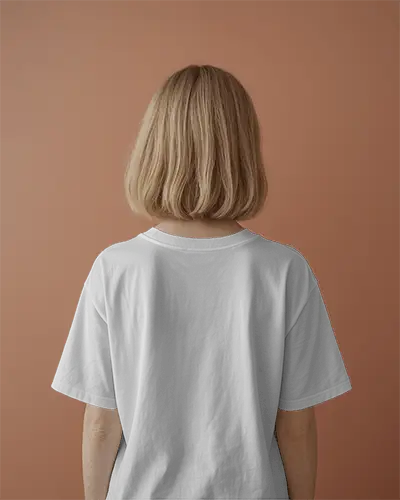 Back View Tshirt Mockup Blonde Female Model On Warm Toned Background Minimalist Aesthetic