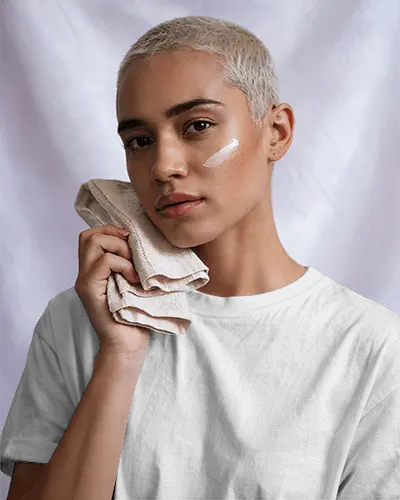 Beauty And Fashion T Shirt Mockup Female Model With Moisturizer Patch And Towel Under Gentle Shadows