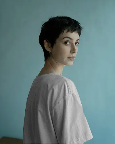 Elegant T Shirt Mockup Female Model In Side Profile With Calm Expression And Subtle Light Perfect For Soft Fashion Launch