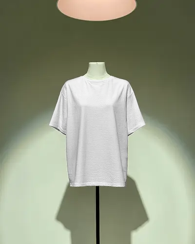 Minimal Display Tshirt Mockup On Mannequin Under Spotlight Isolated Product Showcase Modern Retail Scene