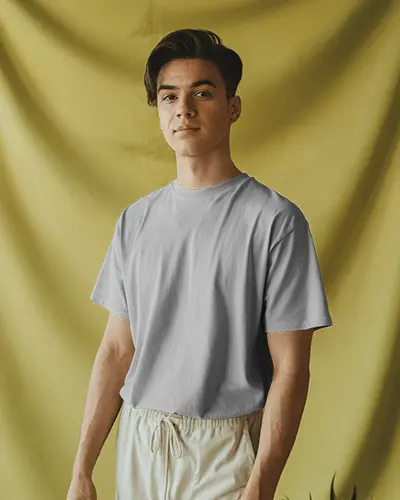Casual Studio Tshirt Mockup Smiling Male Model In Neutral Tones Against Olive Backdrop Modern And Relaxed Vibe