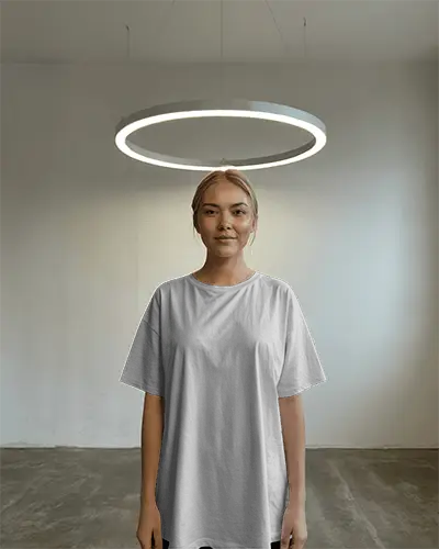 Fashion Forward Minimalist Tshirt Mockup Standing Female Model In Oversized Shirt Under Modern Lamp