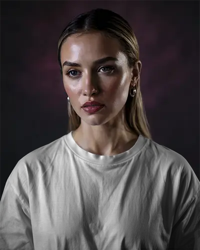 White Tshirt Mockup Female Model Front View Moody Dark Background Soft Lighting High Fashion Expression Bold Eye Makeup