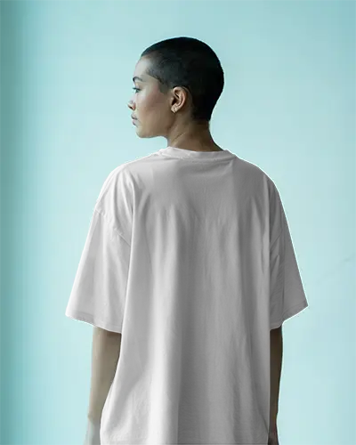 Tshirt Mockup Side Facing Model With Buzzcut Soft Blue Background Relaxed Fit And Clean Back Design Focus