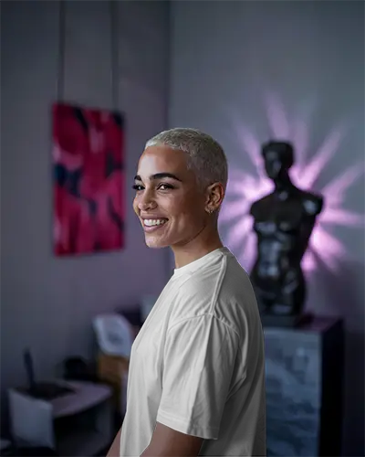 Tshirt Mockup Side Facing Model With Buzzcut Soft Blue Background Relaxed Fit And Clean Back Design Focus