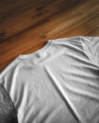 Natural Wood Surface T Shirt Mockup Flat Lay Back View With Evening Light And Soft Shadows Organic And Minimal Aesthetic