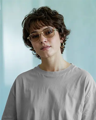 Soft Light Casual T Shirt Mockup Female Model With Glasses Looking Forward In Airy Interior Retro Chic Vibe