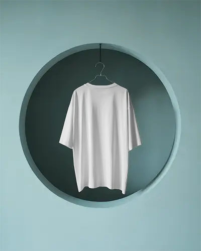 Modern Archway T Shirt Mockup Boxy Fit Hanging Inside Circular Recessed Wall In Pastel Blue Studio Setup
