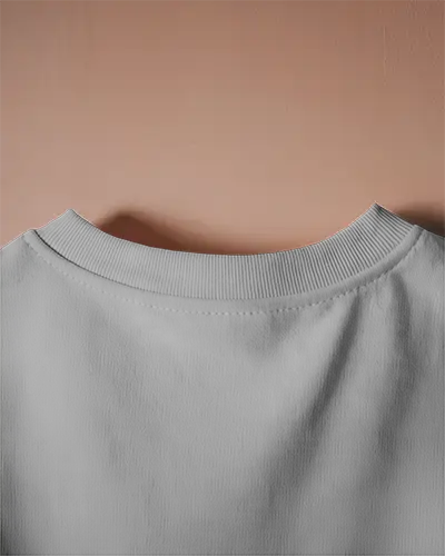 Peach Wall Closeup T Shirt Mockup Back Neck Focus On Minimalist Design And Fabric Texture