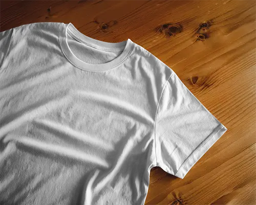 Natural Wooden Surface Tshirt Mockup Relaxed Flatlay With Soft Folds And Even Lighting Cozy And Minimalist Setup