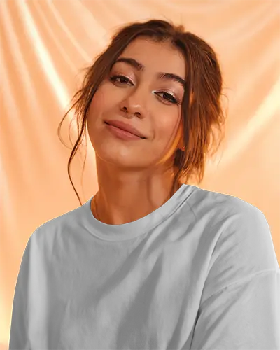 Tshirt Mockup Soft Peach Backdrop Female Model Smiling Gently Warm Glow Aesthetic Closeup Shot