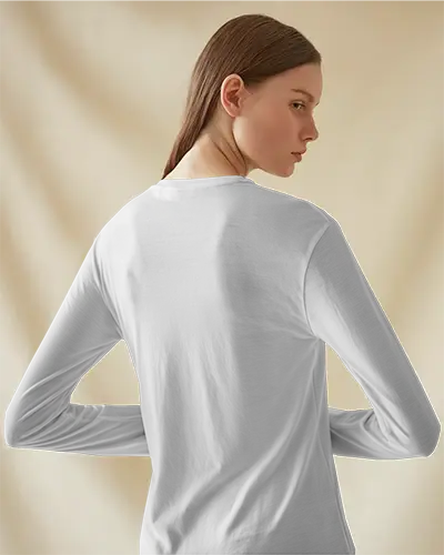 Longsleeve Tshirt Mockup Female Model Posing Backward In Soft Neutral Light With Minimal Curtain Backdrop Elegant And Clean Look