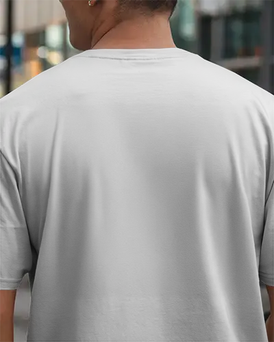 Urban Street Tshirt Mockup Male Model Back View In Daylight With Modern Glass Building Background