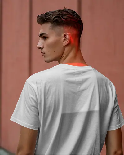 Urban Outdoor Tshirt Mockup Male Model In White Tee With Red Highlight Against Muted Terracotta Wall Modern And Moody Streetwear Style