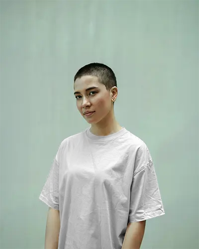 Minimal Outdoor Tshirt Mockup Female Model In White Tee Against Soft Pistachio Green Wall Clean And Modern Look