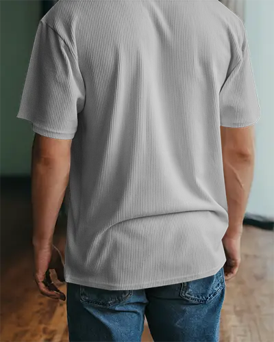 Indoor Tshirt Mockup Back View Man In Ribbed White Shirt And Jeans Soft Lighting Wooden Floor