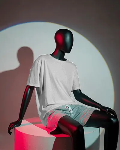 Studio Lit Unisex T Shirt Mockup Minimalistic Seated Pose On White Cylinder Podium In Color Haze