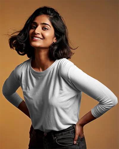 Studio Tshirt Mockup Woman Smiling In White Long Sleeve Tee Dark Jeans Warm Gradient Background