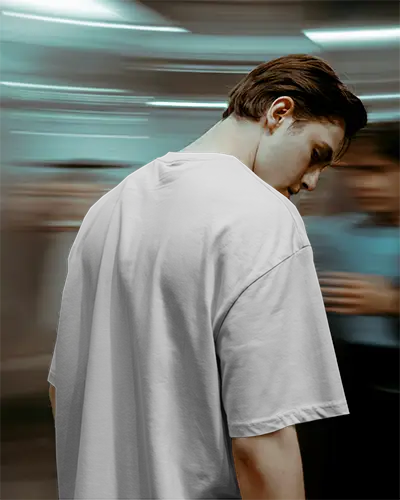 Urban Backview Tshirt Mockup Man In White Tee Motion Blur Crowd Background Modern Edgy Vibe