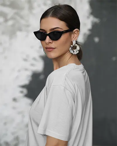 Urban Chic Sleeve Print T Shirt Mockup Female Model In Sunglasses With Bold Earrings Grunge Wall