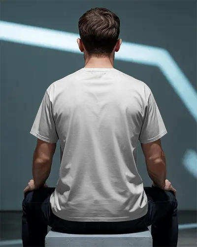 Rear View Tshirt Mockup Male Model In Minimalist Studio Dark Setting With Futuristic Light Effect