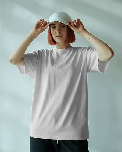 Front Facing Tshirt Mockup Girl In Plain White Tee With Cap In Soft Lit Room Calm Modern Interior