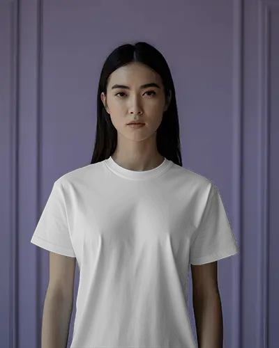Studio Portrait T Shirt Mockup Female Model Facing Forward With Neutral Expression Against Lavender Panel Wall