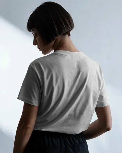 Side Lit T Shirt Mockup Woman Turning Away Showing Back Design In Soft Natural Light Scene