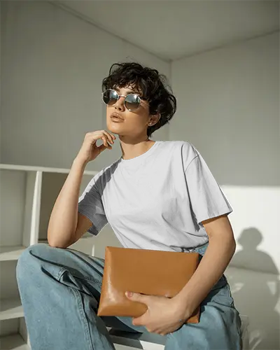 Contemporary Studio T Shirt Mockup Fashion Model With Curly Hair And Sleek Round Sunglasses