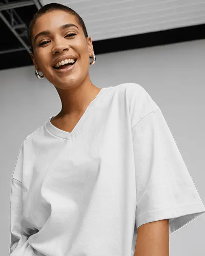 Happy Casual Look T Shirt Mockup Buzzcut Female Model Oversized Gray Tee Against Clean Neutral Wall