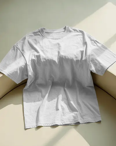 Natural Light Flatlay T Shirt Mockup Spread On Curved Corner With Diffused Morning Sunlight