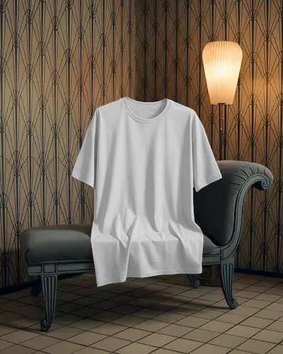 Vintage Luxury Room T Shirt Mockup Draped On Classic Chaise With Art Deco Wallpaper And Lamp