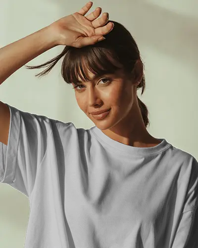 T Shirt Mockup Female Model Posing In Soft Light With Hand On Forehead