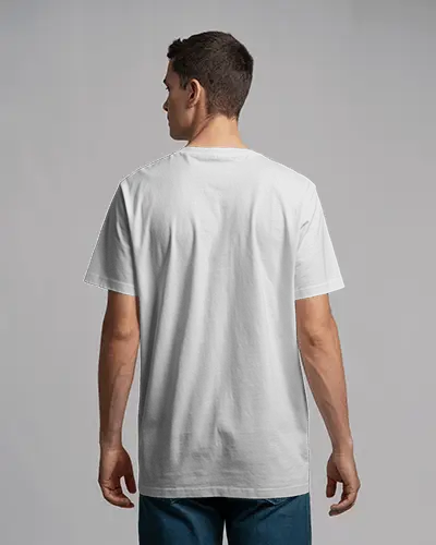Grey Backdrop T Shirt Mockup Back Facing Man Standing In Basic Tee And Blue Denim