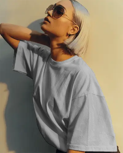 Angled Sunlight T Shirt Mockup Female Model With Sunglasses Striking A Stylish Urban Pose