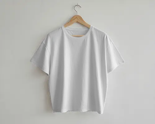 Minimal Studio Hanger Boxy T Shirt Mockup Front View On Wooden Hanger Against White Wall Background