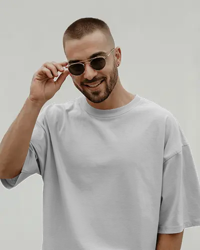 Smiling Male Model In T Shirt Mockup Adjusting Sunglasses On Clean Background Modern Stylish Look