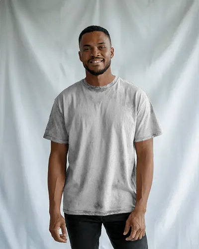 Casual Studio T Shirt Mockup Black Male Model Smiling In Relaxed White Backdrop