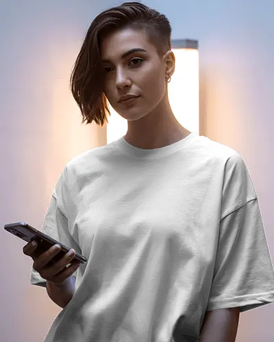 Stylish Urban Woman Model Posing In Oversized T Shirt Mockup With Smartphone Modern Portrait Shot
