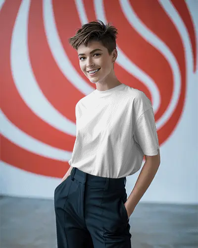abstract-wall-t-shirt-mockup-female-model-smiling-with-hands-in-pocket-modern-studio-look