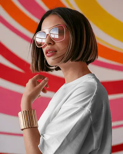 t-shirt-mockup-stylish-woman-wearing-sunglasses-with-pink-orange-swirl-wall-background