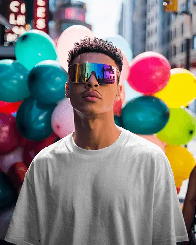 t-shirt-mockup-stylish-man-wearing-sunglasses-in-sunny-street-filled-with-colorful-balloons