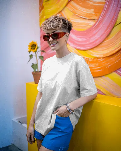 vibrant-streetwear-t-shirt-display-on-trendy-woman-with-curly-hair-and-colorful-wall-art