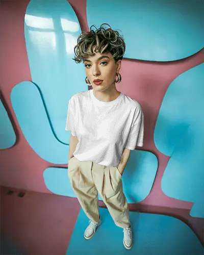 artsy-t-shirt-mockup-on-stylish-model-in-abstract-blue-and-pink-modern-design-backdrop