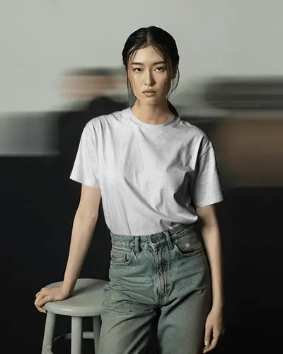 Editorial Tshirt Mockup Female Model Posing With Soft Lighting And Blurred Motion Backdrop